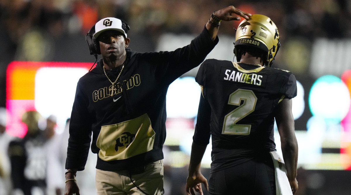 Colorado Buffaloes quarterback Shedeur Sanders (2) and head coach Deion Sanders following a two point conversion vs. Colorado State.